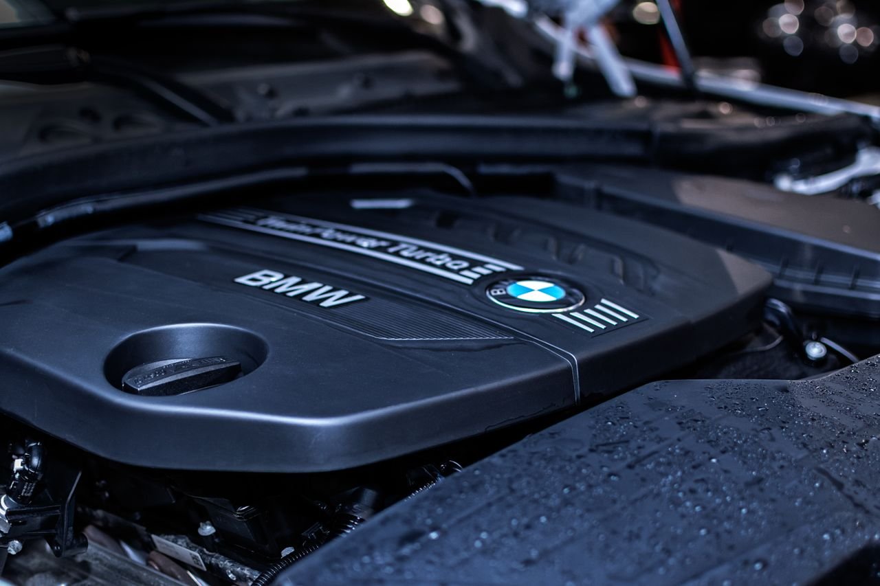 Detailed view of a BMW engine highlighting the turbocharger and modern components.