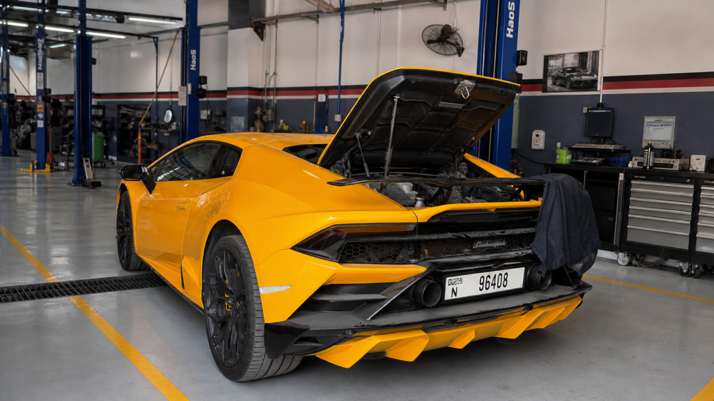 Technician performing diagnostics at the best car service in alqouz dubai
