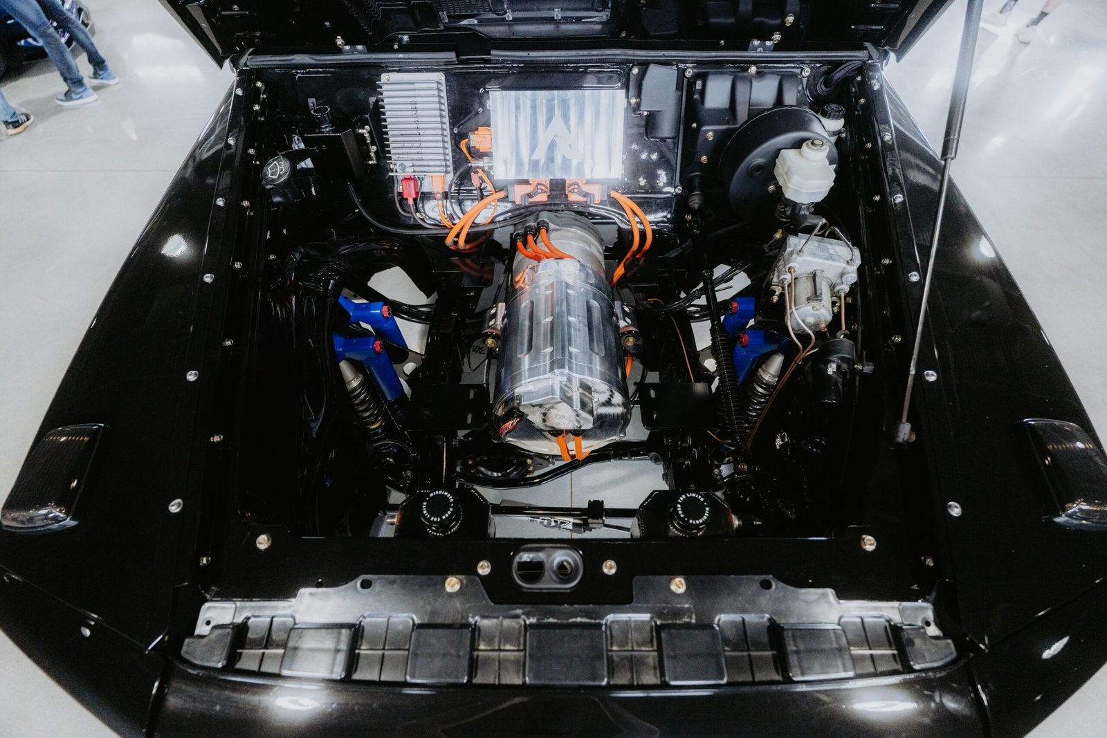 electric-vehicle-service-in-dubai.Top view of a modern electric car engine showcasing technical components and design.